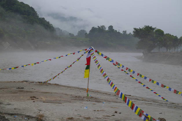 Aftermath of the devastating flash floods in Nepal NUWAKOT, NEPAL - SEPTEMBER 15: A view of the submerged landscape following the devastating flash floods on August 26 that struck Devighat, Nuwakot, Nepal, on September 15, 2026. People in the affected areas of Nuwakot continue to return in search of their destroyed homes and the last remaining memories of their lives. Some are trying to recover essential belongings from the rubble, while others are working with family members to remove soil from parts of their homes buried underground and make them habitable again. The destruction in Devighat village is severe. Many multi-storey buildings have collapsed, while some have been buried under earth up to the level of their fifth floors. Religiou  Copyright: x2026xAnadoluxAbdulxGonix