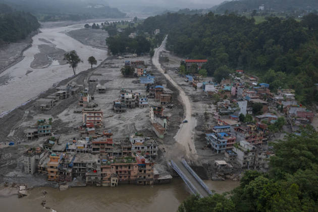 Aftermath of the devastating flash floods in Nepal NUWAKOT, NEPAL - SEPTEMBER 15: A view of the submerged landscape following the devastating flash floods on August 26 that struck Devighat, Nuwakot, Nepal, on September 15, 2026. People in the affected areas of Nuwakot continue to return in search of their destroyed homes and the last remaining memories of their lives. Some are trying to recover essential belongings from the rubble, while others are working with family members to remove soil from parts of their homes buried underground and make them habitable again. The destruction in Devighat village is severe. Many multi-storey buildings have collapsed, while some have been buried under earth up to the level of their fifth floors. Religiou  Copyright: x2026xAnadoluxAbdulxGonix