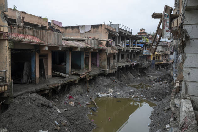 Aftermath of the devastating flash floods in Nepal NUWAKOT, NEPAL - SEPTEMBER 15: A view of the submerged landscape following the devastating flash floods on August 26 that struck Devighat, Nuwakot, Nepal, on September 15, 2026. People in the affected areas of Nuwakot continue to return in search of their destroyed homes and the last remaining memories of their lives. Some are trying to recover essential belongings from the rubble, while others are working with family members to remove soil from parts of their homes buried underground and make them habitable again. The destruction in Devighat village is severe. Many multi-storey buildings have collapsed, while some have been buried under earth up to the level of their fifth floors. Religiou  Copyright: x2026xAnadoluxAbdulxGonix