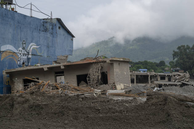 Aftermath of the devastating flash floods in Nepal NUWAKOT, NEPAL - SEPTEMBER 15: A view of the destruction following the devastating flash floods on August 26 that struck Devighat, Nuwakot, Nepal, on September 15, 2026. People in the affected areas of Nuwakot continue to return in search of their destroyed homes and the last remaining memories of their lives. Some are trying to recover essential belongings from the rubble, while others are working with family members to remove soil from parts of their homes buried underground and make them habitable again. The destruction in Devighat village is severe. Many multi-storey buildings have collapsed, while some have been buried under earth up to the level of their fifth floors. Religious figure  Copyright: x2026xAnadoluxAbdulxGonix
