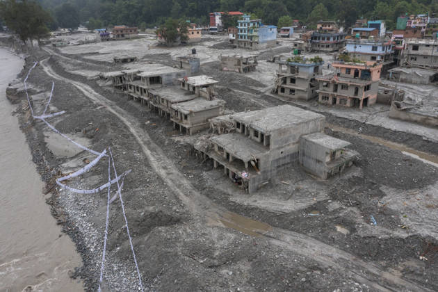 Aftermath of the devastating flash floods in Nepal NUWAKOT, NEPAL - SEPTEMBER 15: A view of the destruction following the devastating flash floods on August 26 that struck Devighat, Nuwakot, Nepal, on September 15, 2026. People in the affected areas of Nuwakot continue to return in search of their destroyed homes and the last remaining memories of their lives. Some are trying to recover essential belongings from the rubble, while others are working with family members to remove soil from parts of their homes buried underground and make them habitable again. The destruction in Devighat village is severe. Many multi-storey buildings have collapsed, while some have been buried under earth up to the level of their fifth floors. Religious figure  Copyright: x2026xAnadoluxAbdulxGonix