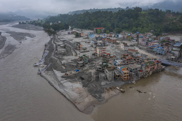 Aftermath of the devastating flash floods in Nepal NUWAKOT, NEPAL - SEPTEMBER 15: A view of the destruction following the devastating flash floods on August 26 that struck Devighat, Nuwakot, Nepal, on September 15, 2026. People in the affected areas of Nuwakot continue to return in search of their destroyed homes and the last remaining memories of their lives. Some are trying to recover essential belongings from the rubble, while others are working with family members to remove soil from parts of their homes buried underground and make them habitable again. The destruction in Devighat village is severe. Many multi-storey buildings have collapsed, while some have been buried under earth up to the level of their fifth floors. Religious figure  Copyright: x2026xAnadoluxAbdulxGonix