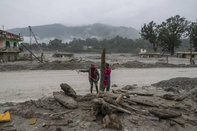 Aftermath of the devastating flash floods in Nepal NUWAKOT, NEPAL - SEPTEMBER 15: A view of the submerged landscape following the devastating flash floods on August 26 that struck Devighat, Nuwakot, Nepal, on September 15, 2026. People in the affected areas of Nuwakot continue to return in search of their destroyed homes and the last remaining memories of their lives. Some are trying to recover essential belongings from the rubble, while others are working with family members to remove soil from parts of their homes buried underground and make them habitable again. The destruction in Devighat village is severe. Many multi-storey buildings have collapsed, while some have been buried under earth up to the level of their fifth floors. Religiou  Copyright: x2026xAnadoluxAbdulxGonix