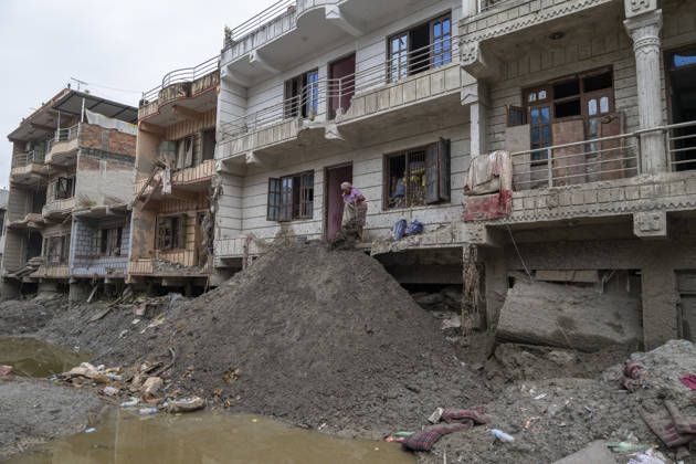 Aftermath of the devastating flash floods in Nepal NUWAKOT, NEPAL - SEPTEMBER 15: A view of the submerged landscape following the devastating flash floods on August 26 that struck Devighat, Nuwakot, Nepal, on September 15, 2026. People in the affected areas of Nuwakot continue to return in search of their destroyed homes and the last remaining memories of their lives. Some are trying to recover essential belongings from the rubble, while others are working with family members to remove soil from parts of their homes buried underground and make them habitable again. The destruction in Devighat village is severe. Many multi-storey buildings have collapsed, while some have been buried under earth up to the level of their fifth floors. Religiou  Copyright: x2026xAnadoluxAbdulxGonix