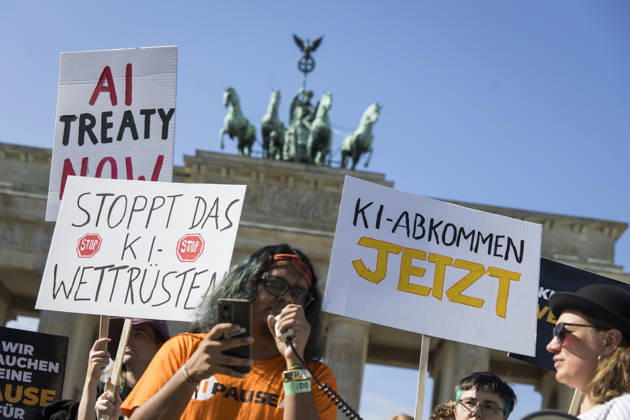 Pause AI, demonstration in front of the Brandenburg Gate, Berlin, September 15, 2026. Members holding signs reading AI Treaty Now and Stop the AI Arms Race and AI Treaty Now to call for a pause in AI development during a demonstration by the Pause AI movement in front of the Brandenburg Gate, Berlin, September 15, 2026; Berlin, Brandenburg Gate Copyright: xBenxKriemannx