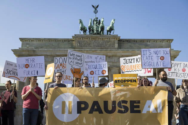 Pause AI, demonstration in front of the Brandenburg Gate, Berlin, September 15, 2026. Members holding signs calling for a pause in AI development during a demonstration by the Pause AI movement in front of the Brandenburg Gate, Berlin, September 15, 2026. Berlin, Brandenburg Gate Copyright: xBenxKriemannx