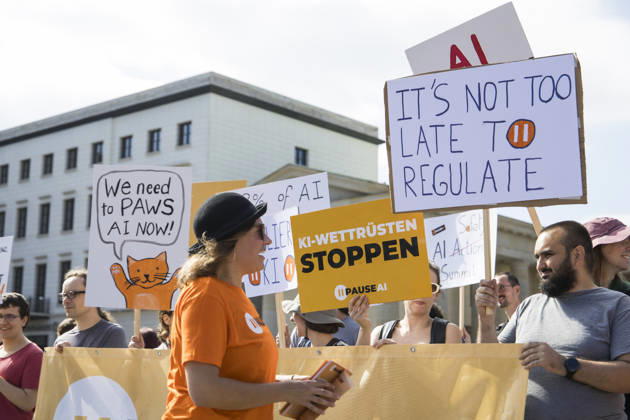 Pause AI, demonstration in front of the Brandenburg Gate, Berlin, September 15, 2026. Members holding signs calling for a pause in AI development during a demonstration by the Pause AI movement in front of the Brandenburg Gate, Berlin, September 15, 2026. Berlin, Brandenburg Gate Copyright: xBenxKriemannx