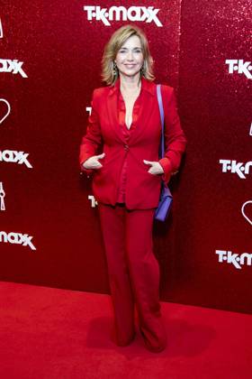 ABB TKMAXX Tina Ruland in a red pantsuit on the red carpet at the grand reopening of the TK Maxx store on Alexanderplatz on September 24, 2026, in Berlin, Germany