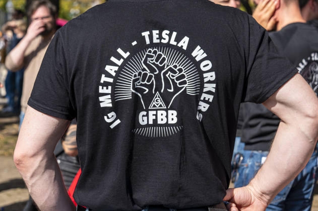 Social protests organized by the DGB, Germany, Berlin, September 26, 2026. TESLA employees: There’s Enough for Everyone and Merz Must Go. Posters, banners, and slogans against the federal government’s cuts to social benefits. Cutting social benefits, Nationwide social protests organized by the DGB and its member unions under the slogan You’ve Earned It: Your