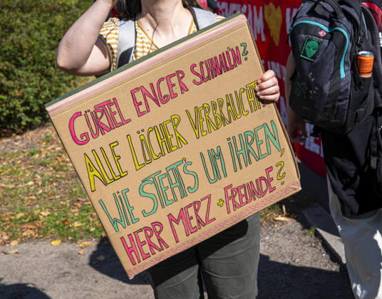 Social protests organized by the DGB EUR, Germany, Berlin, September 26, 2026 There’s Enough for Everyone, and Merz Must Go —posters, banners, and slogans against the federal government’s cuts to social benefits. Cutting Social Benefits —nationwide social protests organized by the DGB and its member unions under the slogan You’ve Earned It: Your Work, Your Health, Your Pension