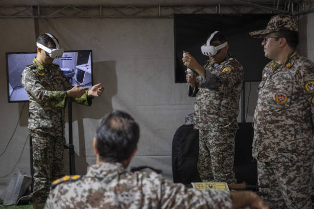 Opening Ceremony Of Second City-Square Military Training Camp Iranian Army servicemen wear virtual reality headsets to shoot with virtual rifles during the opening ceremony of the second city-square military training camp for self-sacrificing forces in downtown Tehran, Iran, on October 3, 2026. The camp was established by the Basij paramilitary force, with personnel from the Islamic Republic of Iran Army responsible for training the volunteers. Tehran Tehran Iran Copyright: xMortezaxNikoubazlx originalFilename: nikoubazl-openingc261003_np2gu