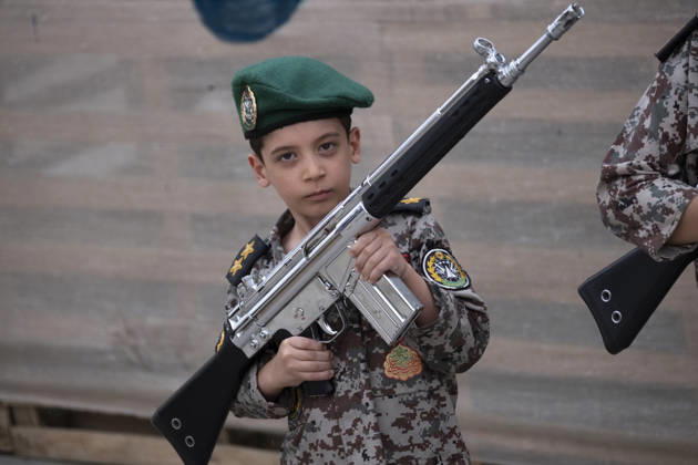 Opening Ceremony Of Second City-Square Military Training Camp An Iranian schoolboy wearing an Iranian Army military uniform holds a rifle while taking part in the opening ceremony of the second city-square military training camp for self-sacrificing forces in downtown Tehran, Iran, on October 3, 2026. The camp was established by the Basij paramilitary force, with personnel from the Islamic Republic of Iran Army responsible for training the volunteers. Tehran Tehran Iran Copyright: xMortezaxNikoubazlx originalFilename: nikoubazl-openingc261003_npA2r