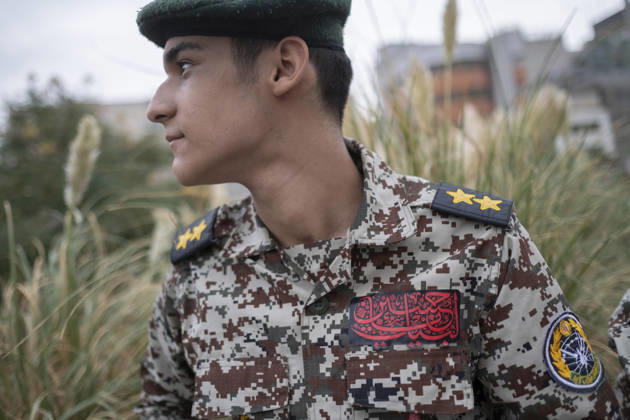 Opening Ceremony Of Second City-Square Military Training Camp An Iranian schoolboy wearing an Iranian Army military uniform looks on while preparing to take part in the opening ceremony of the second city-square military training camp for self-sacrificing forces in downtown Tehran, Iran, on October 3, 2026. The camp was established by the Basij paramilitary force, with personnel from the Islamic Republic of Iran Army responsible for training the volunteers. Tehran Tehran Iran Copyright: xMortezaxNikoubazlx originalFilename: nikoubazl-openingc261003_npFBW