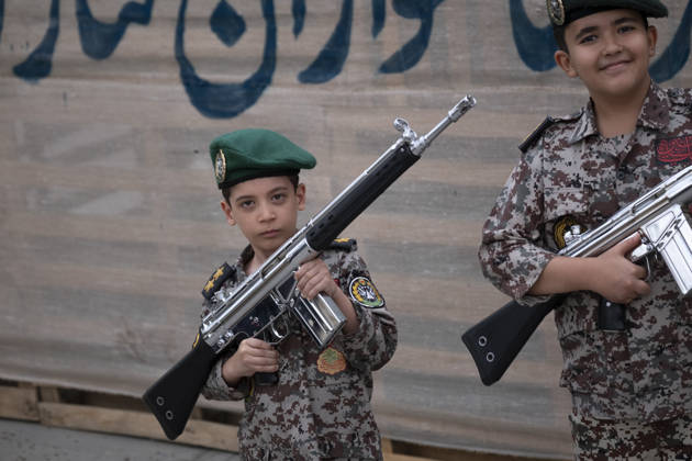 Opening Ceremony Of Second City-Square Military Training Camp Two Iranian schoolboys wearing military uniforms hold rifles during the opening ceremony of the second city-square military training camp for self-sacrificing forces in downtown Tehran, Iran, on October 3, 2026. The camp was established by the Basij paramilitary force, with personnel from the Islamic Republic of Iran Army responsible for training the volunteers. Tehran Tehran Iran Copyright: xMortezaxNikoubazlx originalFilename: nikoubazl-openingc261003_npIPT