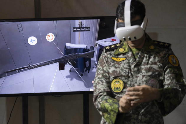 Opening Ceremony Of Second City-Square Military Training Camp An Iranian Army serviceman wears a virtual reality headset to shoot with a virtual rifle during the opening ceremony of the second city-square military training camp for self-sacrificing forces in downtown Tehran, Iran, on October 3, 2026. The camp was established by the Basij paramilitary force, with personnel from the Islamic Republic of Iran Army responsible for training the volunteers. Tehran Tehran Iran Copyright: xMortezaxNikoubazlx originalFilename: nikoubazl-openingc261003_npkJa