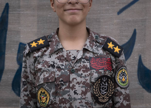 Opening Ceremony Of Second City-Square Military Training Camp An Iranian schoolboy wearing an Iranian Army military uniform smiles while standing at attention during the opening ceremony of the second city-square military training camp for self-sacrificing forces in downtown Tehran, Iran, on October 3, 2026. The camp was established by the Basij paramilitary force, with personnel from the Islamic Republic of Iran Army responsible for training the volunteers. Tehran Tehran Iran Copyright: xMortezaxNikoubazlx originalFilename: nikoubazl-openingc261003_npMff