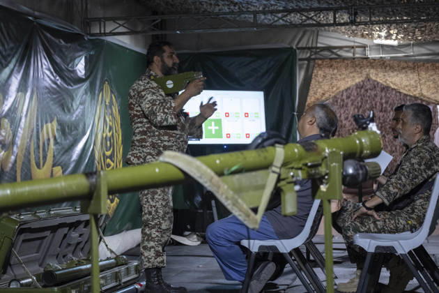 Opening Ceremony Of Second City-Square Military Training Camp An Iranian Army serviceman demonstrates the operation of a shoulder-launched weapon to volunteers during the opening ceremony of the second city-square military training camp for self-sacrificing forces in downtown Tehran, Iran, on October 3, 2026. The camp was established by the Basij paramilitary force, with personnel from the Islamic Republic of Iran Army responsible for training the volunteers. Tehran Tehran Iran  Copyright: xMortezaxNikoubazlx originalFilename: nikoubazl-openingc261003_npxw6.jpg