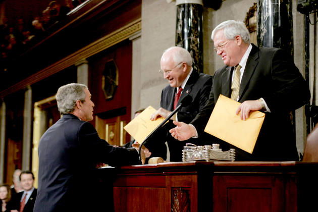 February 2, 2005, Washington, District Of Columbia, USA: United States President George W. Bush, left, hands copies of his speech to United States Vice President Dick Cheney, center, and the Speaker of the United States House of Representatives J. Dennis Hastert (Republican from the 14th District of Illinois), right, prior to delivering his State ofthe Union Address to a Joint Session of Congress in the Capitol in Washington, D.C. on February 2, 2005 Washington USA - ZUMAs152 20050202_faa_s152_016 Copyright: xLukexFrazzax