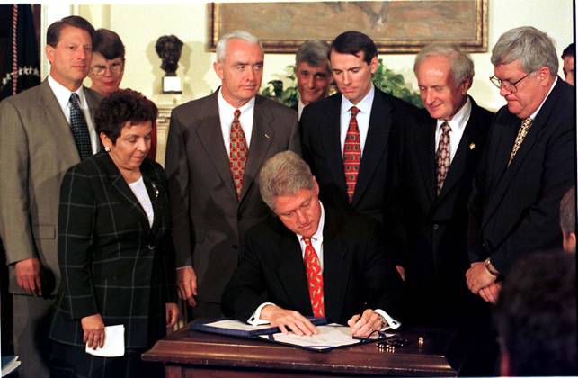 **FILE PHOTO** Dennis Hastert Has Passed Away. United States President Bill Clinton signs the Drug-Free Communities Act of 1997 at the White House in Washington, D.C. on June 27, 1997. Standing behind the President, left to right, U.S. Vice President Al Gore, U.S. Attorney General Janet Reno, U.S. Secretary of Health and Human Services (HHS) Donna Shalala, General Barry McCaffrey, U.S. Secretary of the Treasury Robert Rubin, U.S. Representative Rob Portman (Republican of Ohio), U.S. Representative Sandy Levin (Democrat of Michigan), and U.S. Representative Dennis Hastert (Republican of Illinois).. Copyright: x 1997xRonxSachsxxxConsolidatedxNewsxPhotosxxxAllxRightsxReservedx