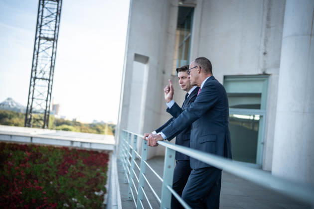 Chancellor Friedrich Merz with his guest Mindaugas Sinkeviciusius, Prime Minister of Lithuania, at the Federal Chancellery; on the terrace of the Federal Chancellery overlooking the Reichstag building, which houses the Bundestag; the Federal Chancellor receives the Prime Minister of the Republic of Lithuania at the Federal Chancellery, Berlin, Germany; Federal Chancellery