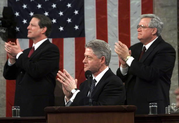 Dennis Hastert (1942 - 2026) United States President Bill Clinton is joined by U.S. Vice President Al Gore, left, and Speaker of the House Dennis Hastert (Republican of Illinois), right, as he applauds Lyn Gibson and Wei Ling Chestnut, the widows of the two Capitol policeofficers who were killed in 1998 as he begins the State of the Union Address during a Joint Session of Congress in Washington, D.C. on January 19, 1999. .Credit: Win McNamee CNP AdMedia EDITORIAL USE ONLY  Copyright: xx AdMediax admphotosthree019185