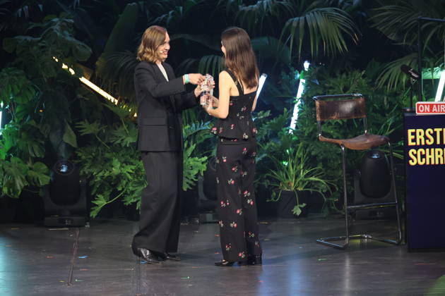 FIRST STEPS 2026 Big Audience Award Acceptance Speech by Magdalena Prosteder and the Big Audience Award-winning book *OPERATION OBERLAND* by Patricia SchuÌˆtz; Award presentation on stage at the FIRST STEPS 2026 ceremony at the Theater des Westens in Berlin Copyright: xEventpressxFuhrx
