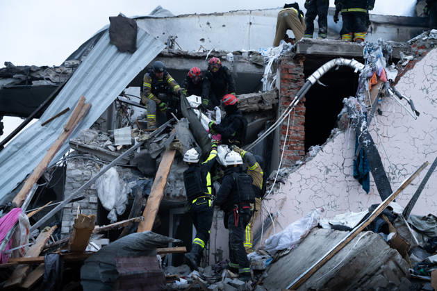 October 5, 2026, Kharkiv, Kharkiv Oblast, Ukraine: Local rescue workers, firefighters and Red Cross volunteers clear rubble following a Russian aerial attack on a bus repair warehouse which killed two people in Kharkiv, Ukraine. Emergency crews search through the heavily damaged building and collapsed sections of the warehouse for survivors and the remains of those killed in the attack. Kharkiv Ukraine - ZUMAm350 20261005_zip_m350_016 Copyright: xCameronxJones-Manleyx