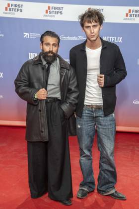 ABB FIRSTSTEPS: Arman Kashani and Oskar Belton on the red carpet at the 2026 FIRST STEPS Awards ceremony at the Theater des Westens on October 5, 2026, in Berlin, Germany