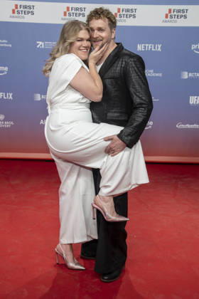 ABB FIRSTSTEPS: Gisa Flake and Knud Riepen walk the red carpet at the 2026 FIRST STEPS Awards ceremony at the Theater des Westens on October 5, 2026, in Berlin, Germany
