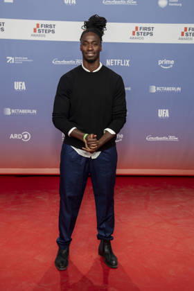 ABB FIRSTSTEPS: Eugene Boateng walks the red carpet at the 2026 FIRST STEPS Awards ceremony at the Theater des Westens on October 5, 2026, in Berlin, Germany