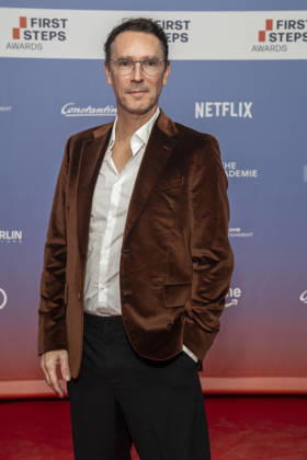 ABB FIRSTSTEPS: Sascha Schwingel walks the red carpet at the 2026 FIRST STEPS Awards ceremony at the Theater des Westens on October 5, 2026, in Berlin, Germany