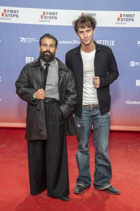 ABB FIRSTSTEPS: Arman Kashani and Oskar Belton on the red carpet at the 2026 FIRST STEPS Awards ceremony at the Theater des Westens on October 5, 2026, in Berlin, Germany