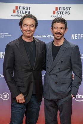 ABB FIRSTSTEPS: Martin Bachmann and Oliver Berben on the red carpet at the 2026 FIRST STEPS Awards ceremony at the Theater des Westens on October 5, 2026, in Berlin, Germany