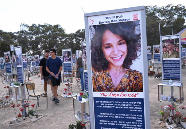 People look at photos of hundreds of victims killed by Hamas on October 7, 2023, at the Nova Festival Memorial site in Re im, near the Gaza border on Monday, October 6, 2026. Israel is marking three years since the Hamas attack that killed 1,200 people and 251 were taken hostage into Gaza.  JER2026100603 DEBBIExHILL