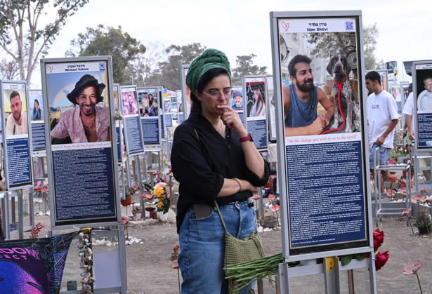 People look at photos of hundreds of victims killed by Hamas on October 7, 2023, at the Nova Festival Memorial site in Re im, near the Gaza border on Monday, October 6, 2026. Israel is marking three years since the Hamas attack that killed 1,200 people and 251 were taken hostage into Gaza.  JER2026100617 DEBBIExHILL