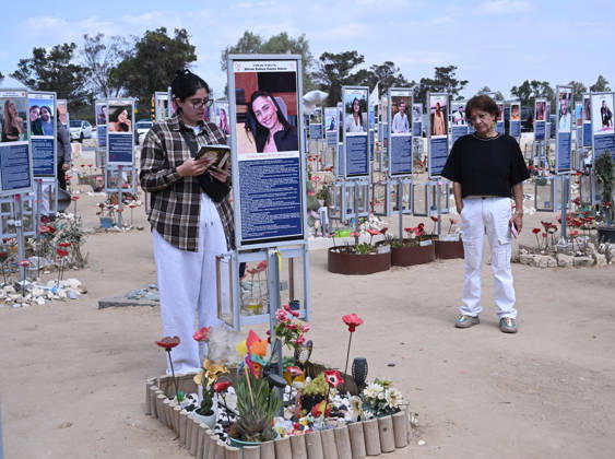 An Israeli woman prays in front of a photo of a victim killed by Hamas on October 7, 2023, at the Nova Festival Memorial site in Re im, near the Gaza border on Monday, October 6, 2026. Israel is marking three years since the Hamas attack that killed 1,200 people and 251 were taken hostage into Gaza.  JER2026100619 DEBBIExHILL