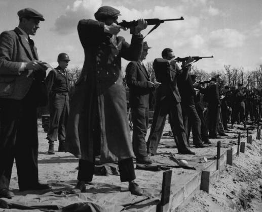 Civilian Guard Trainees On Rifle Range German civilians who are being trained for a Civilian Guard for duty at military installations in Berlin, by German-speaking American soldiers, try their skill at the rifle range at the end of a training period. June 4, 1946. (Photo by Associated Press Photo).  Copyright: xAssociatedxPressxPhotox 5513-76010948