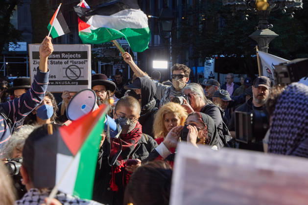 October 7, 2026, New York, New York, USA: A protester raises a megaphone as demonstrators hold flags and signs during a pro-Palestinian rally at City Hall Park in New York City, New York. New York USA  - ZUMAs237 20261007_aap_s237_005 Copyright: xMarkxJ.xSullivanx