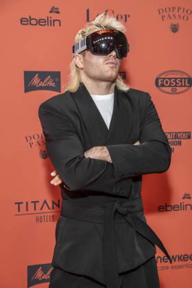 ABB ABOUTYOU Ski Aggu as a guest on the orange carpet at the ABOUT YOU Opera Fashion Show at the Admiralspalast on October 7, 2026, in Berlin, Germany