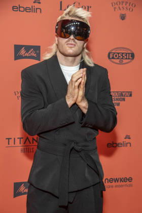 ABB ABOUTYOU Ski Aggu as a guest on the orange carpet at the ABOUT YOU Opera Fashion Show at the Admiralspalast on October 7, 2026, in Berlin, Germany