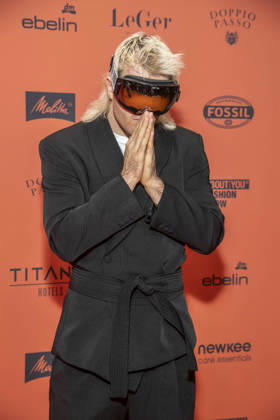 ABB ABOUTYOU Ski Aggu as a guest on the orange carpet at the ABOUT YOU Opera Fashion Show at the Admiralspalast on October 7, 2026, in Berlin, Germany