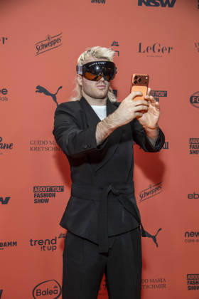 ABB ABOUTYOU Ski Aggu as a guest on the orange carpet at the ABOUT YOU Opera Fashion Show at the Admiralspalast on October 7, 2026, in Berlin, Germany