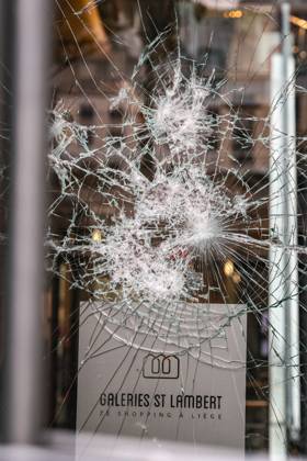 storefront window was damaged after a protest against education reforms and budget cuts, on Thursday 8 October 2026. For several days protests turned violent, mainly due to rioters who vandalize the city centre and face police. The city of Liege announced a ban of gathering of more than three minors on public space, unless with a responsible adult, to prevent the gathering of rioters who have nothing to do with the original movement.  BRUNOxFAHY 189130019