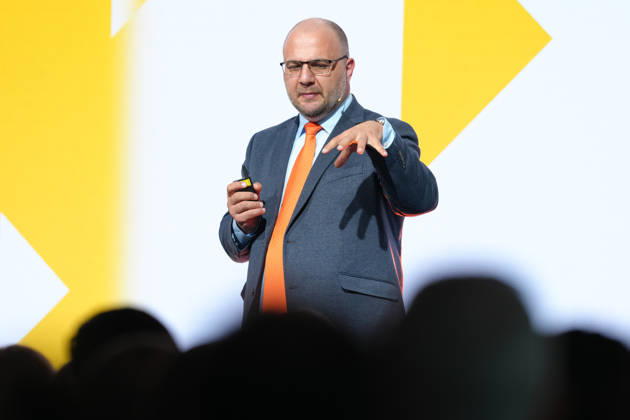 Brand Economy Day 2026: Author and speaker Stefan Kolev on stage during his keynote address at Brand Economy Day 2026, Berlin, October 8, 2026, Berlin, Berlin, Germany
