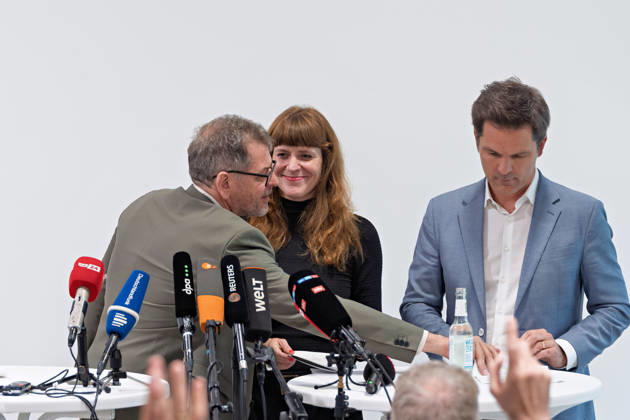 Berlin, October 8, 2026: Werner Graf of Alliance 90 The Greens (left) speaks during a joint press conference following the conclusion of preliminary talks between their parties in the foyer of the Haus der Statistik with Kerstin Wolter Ehling of The Left (center), and Steffen Krach of the SPD (right). Press conference by The Left, the Greens, and the SPD in Berlin