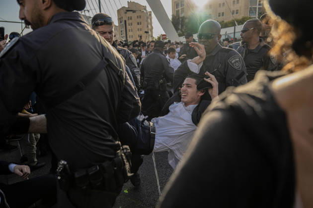 Anti-military service Ultra-Orthodox Jews block road to West Jerusalem JERUSALEM - OCTOBER 8: Israeli police deployed to the scene intervene against the demonstrators as Ultra-Orthodox Jews, known as Haredi, protest the lack of legislation exempting yeshiva students from mandatory military service and the detention of students on grounds of draft evasion in West Jerusalem, on October 8, 2026. Haredi protesters lie on the road leading to West Jerusalem and block traffic. Mostafa Alkharouf Anadolu Jerusalem Israel. Editorial use only. Please get in touch for any other usage.  Copyright: x2026xAnadoluxMostafaxAlkharoufx