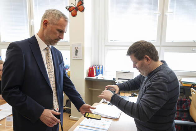 The two-day elections to municipal assemblies started in the Czech Republic together with the first round of the elections to one-third of the Senate, on October 9, 2026. On the photo Zdenek Hrib, chairman of the Czech Pirate Party (Pirates), identifies himself to a polling station official using the eDoklady app (digital ID copy) on his mobile phone before casting his vote, in Prague, Czech Republic. (CTKxPhoto MichalxKamaryt) CTKPhotoP2026100905066  CTKPhotoP2026100905066