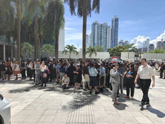 (261009) -- PANAMA CITY, Oct. 9, 2026 -- People gather outside following an earthquake in Panama City, Panama, Oct. 9, 2026. Major earthquake strikes Panama on Friday. ) PANAMA-PANAMA CITY-EARTHQUAKE LixJiaxu 