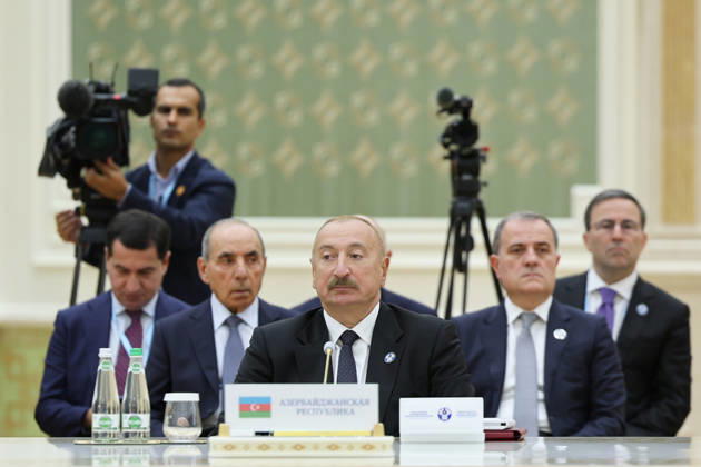 October 9, 2026, Turkmenbashi, Turkmenistan: Azerbaijani President Ilham Aliyev sits behind Azerbaijan s nameplate during the CIS Council of Heads of State meeting in the Avaza National Tourist Zone in Turkmenbashi, Turkmenistan, on October 9, 2026. The meeting, chaired by Turkmen President Serdar Berdimuhamedov, brought together leaders of CIS states and CIS Secretary General Sergey Lebedev, with Pezeshkian participating for the first time as a special guest. Turkmenbashi Turkmenistan - ZUMAi98_ 20261009_zih_i98_042 Copyright: xIranianxPresidencyx