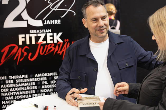 Sebastian Fitzek at the Frankfurt Book Fair, October 9, 2026. German bestselling author and thriller writer Sebastian Fitzek at a book-signing event at the 2026 Frankfurt Book Fair. At the booth of his publisher, Droemer Knau